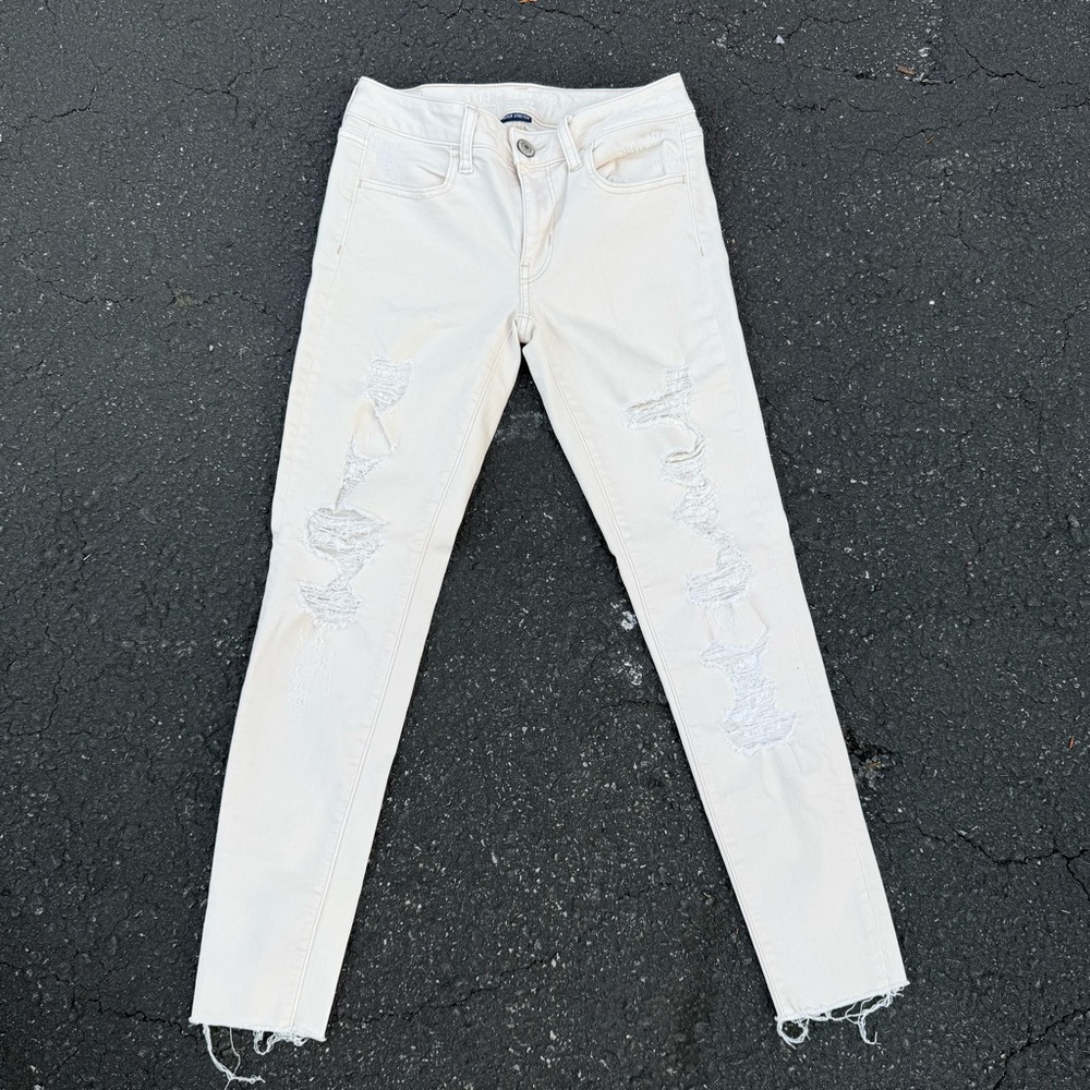 American Eagle Outfitters Cream Distressed Skinny Jeans
